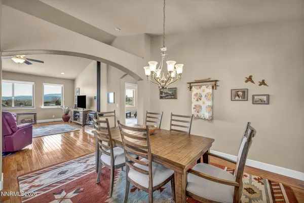 a spacious bathroom with a granite countertop sink a mirror and a shower