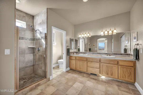 a bedroom with furniture and book shelf