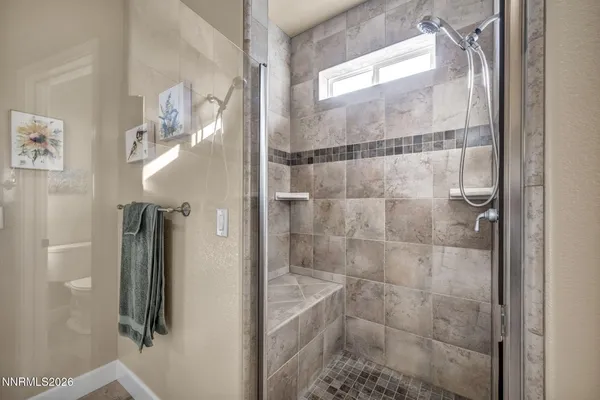 a view of a room with gym equipment and floor to ceiling window