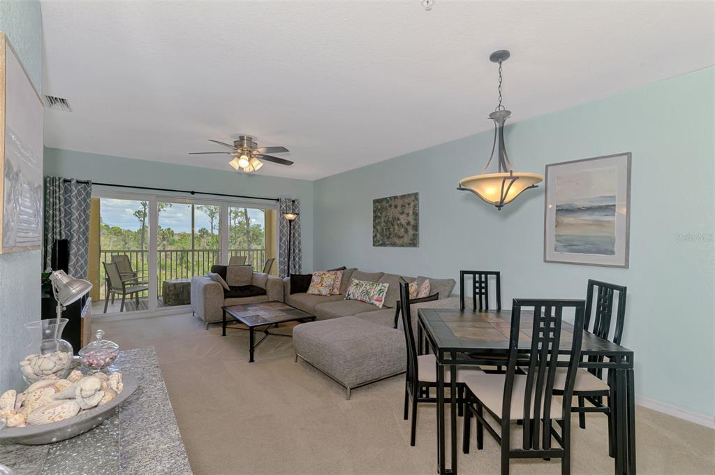 8409 Placida Road, Unit 206 Placida, FL 33946 - Photo 11 of 67 a living room with furniture and window