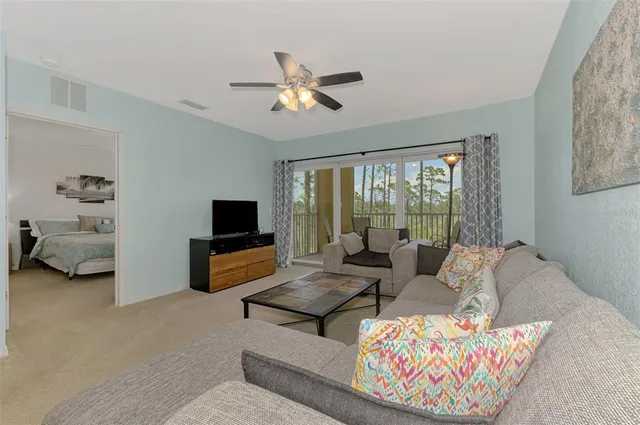 a kitchen with kitchen island granite countertop a sink a stove and microwave
