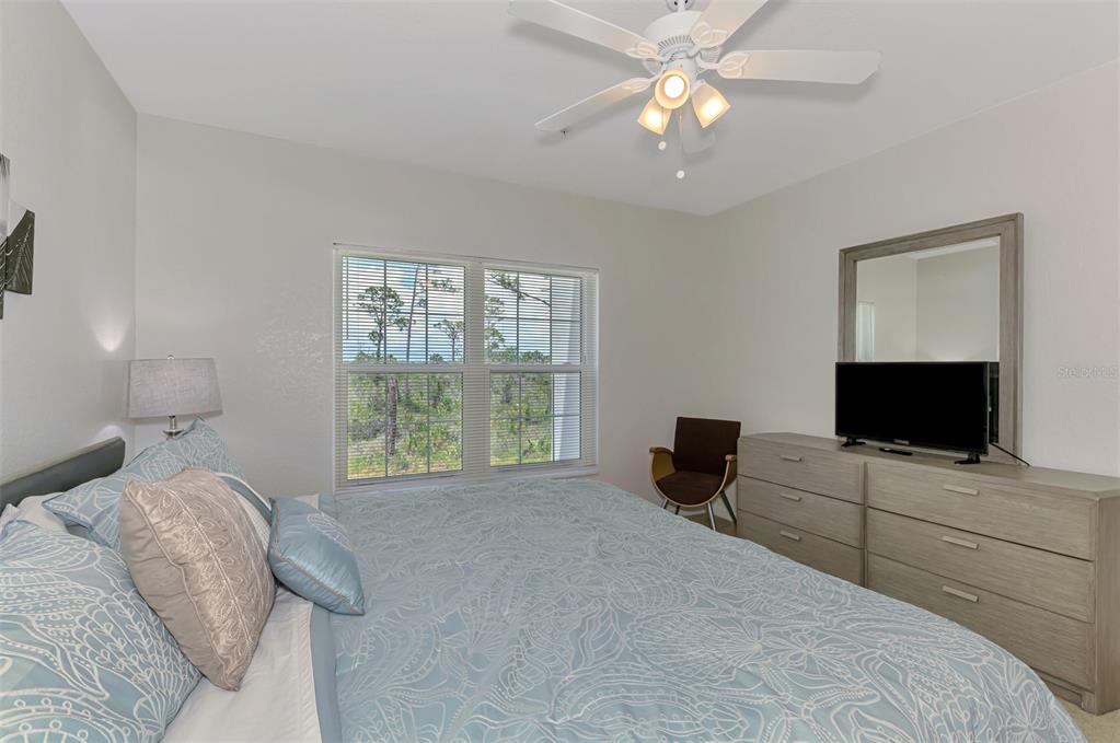 8409 Placida Road, Unit 206 Placida, FL 33946 - Photo 28 of 67 a bedroom with a bed and a flat screen tv