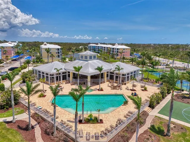 a view of backyard with swimming pool and patio
