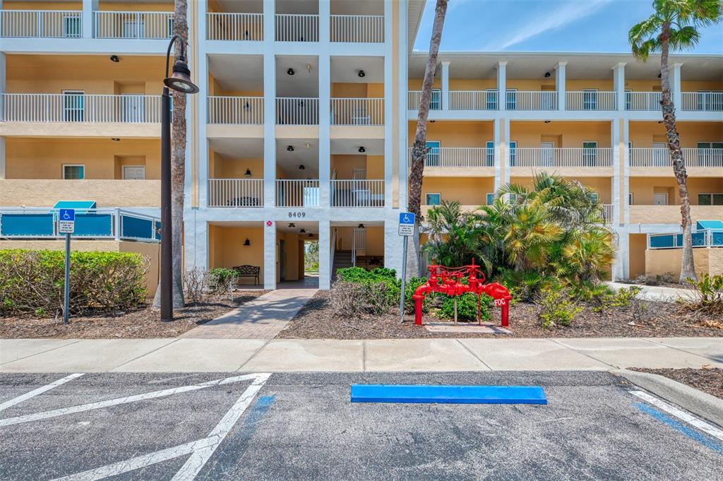 8409 Placida Road, Unit 206 Placida, FL 33946 - Photo 6 of 67 a view of flower garden in front of a building