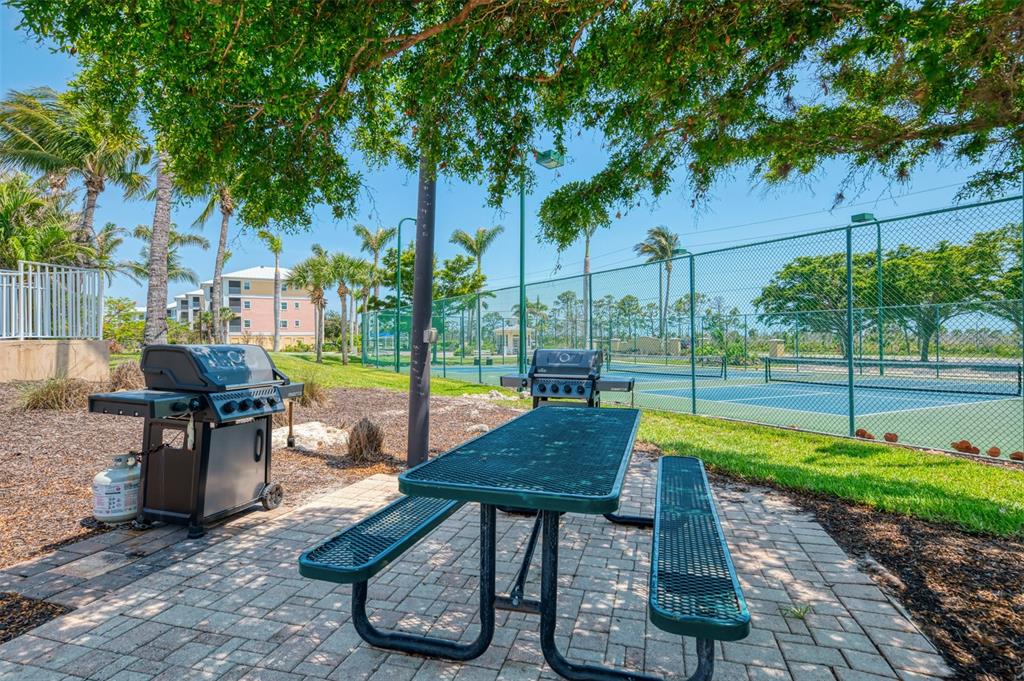 8409 Placida Road, Unit 206 Placida, FL 33946 - Photo 63 of 67 a view of backyard with swimming pool and patio