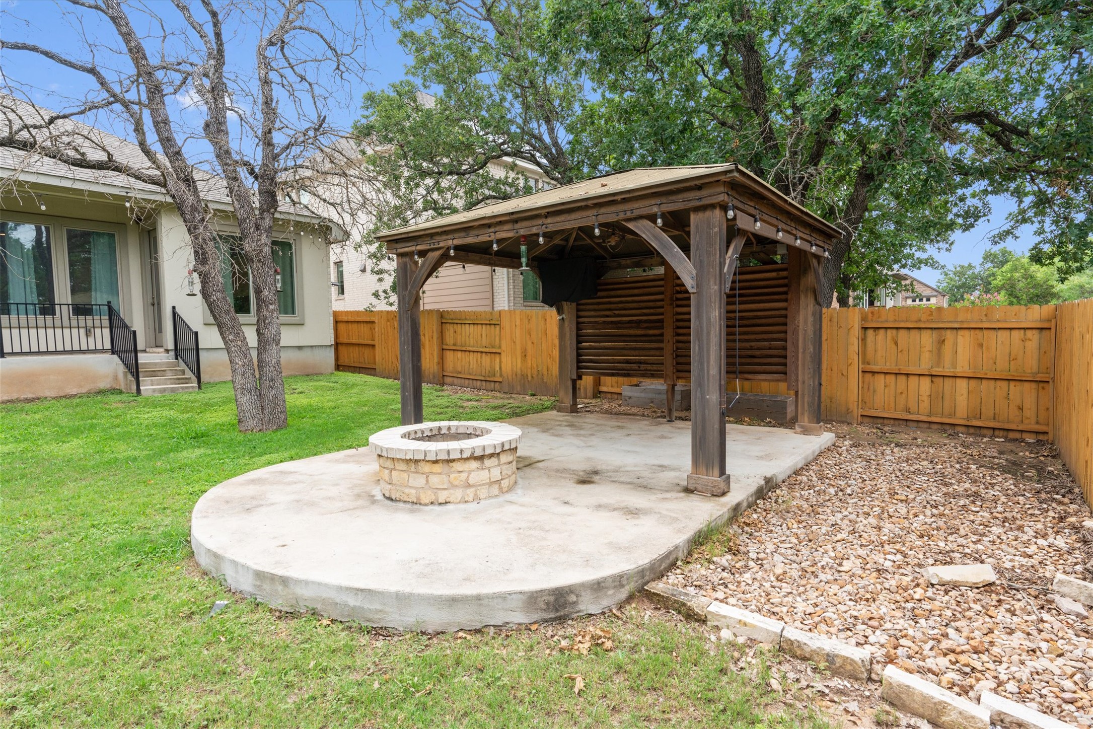 941 Del Raphael Drive Leander, TX 78641 - Photo 25 of 31 The custom wooden pergola is just begging for an outdoor dining table, string lights, and weekend game-day viewings