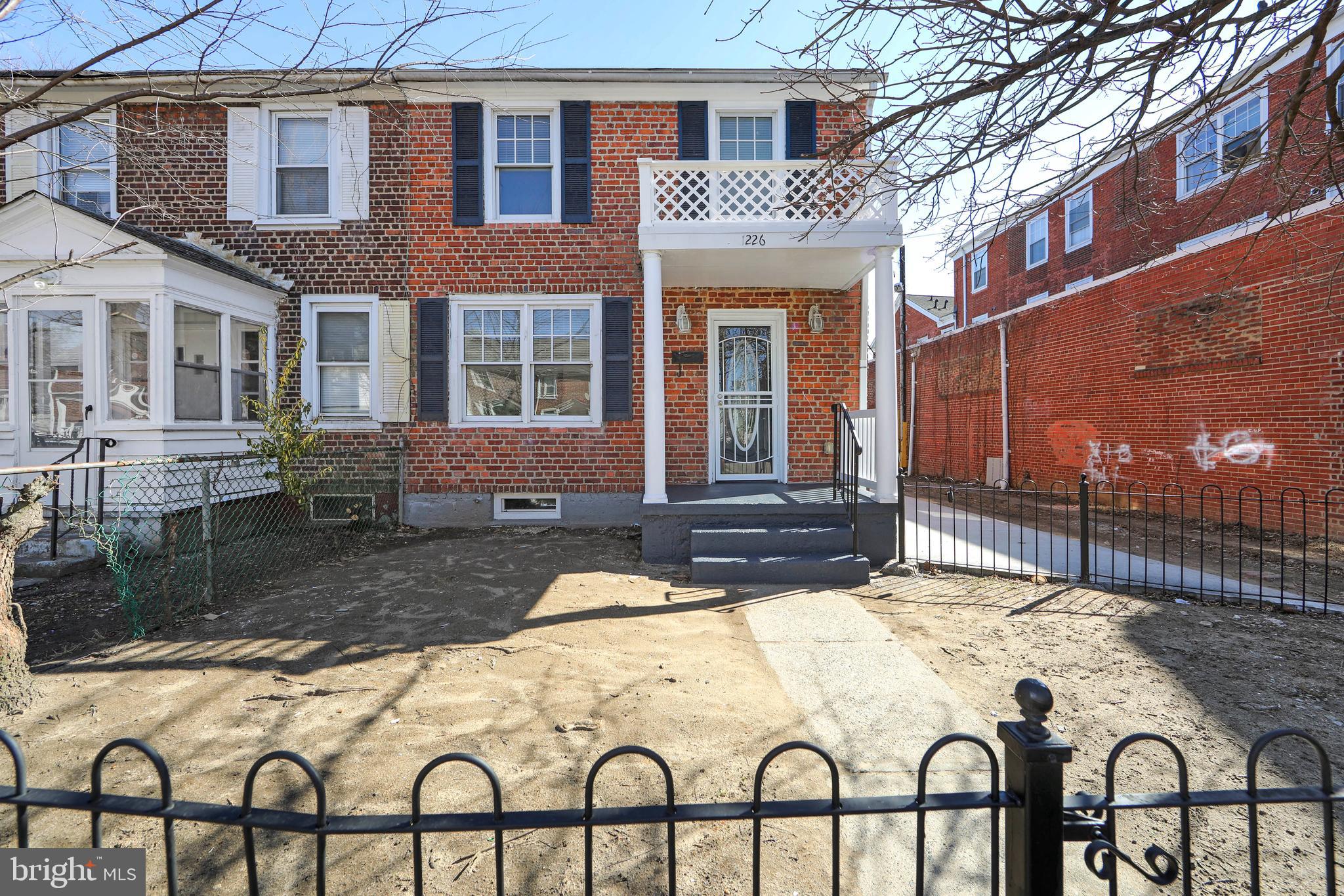 1226 America Road Camden, NJ 08104 - Photo 2 of 30 a view of a brick house with large windows