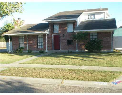 a view of a white house with swimming pool