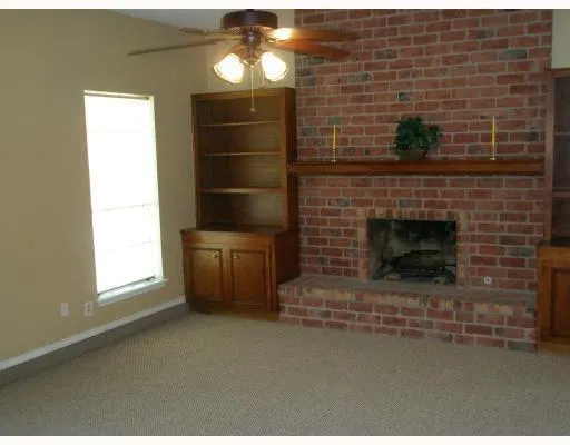 a fireplace with a chair