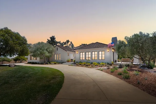 a city view with tall buildings and a yard