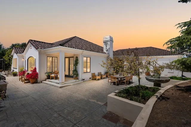 a view of a house with patio outdoor seating area