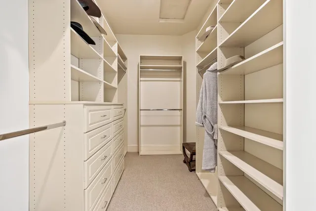 a bathroom with a sink vanity mirror and toilet