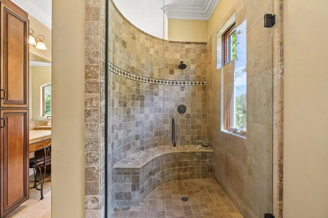 a bedroom with furniture and a window