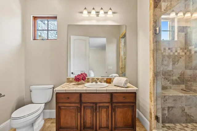 a view of a house with backyard sitting area and garden