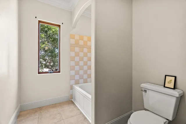 a view of a swimming pool with outdoor seating