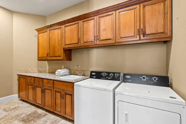 a view of a white house with a yard