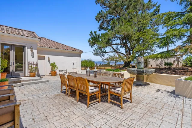 a front view of a house with a garden and yard