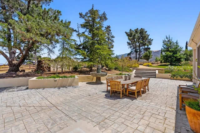 a kitchen with cabinets and wooden floor