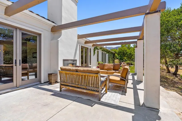 an aerial view of a house with outdoor space