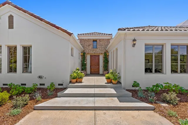 a view of a hallway view with wooden floor and staircase