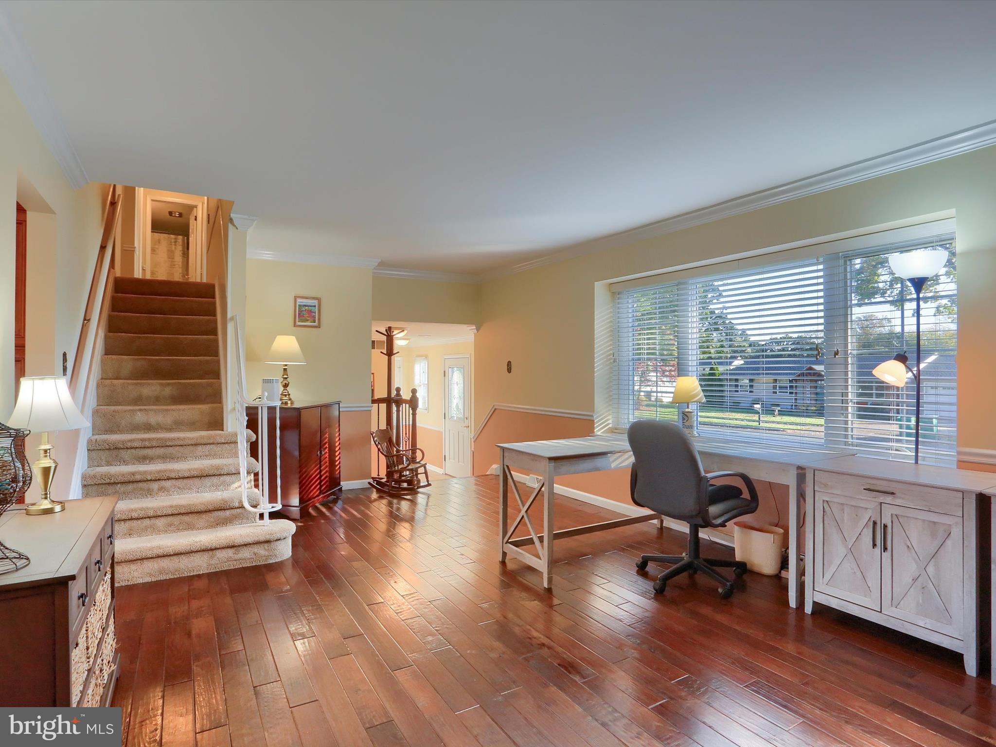 5256 Strathmore Drive Mechanicsburg, PA 17050 - Photo 13 of 47 a view of a workspace with wooden floor and furniture