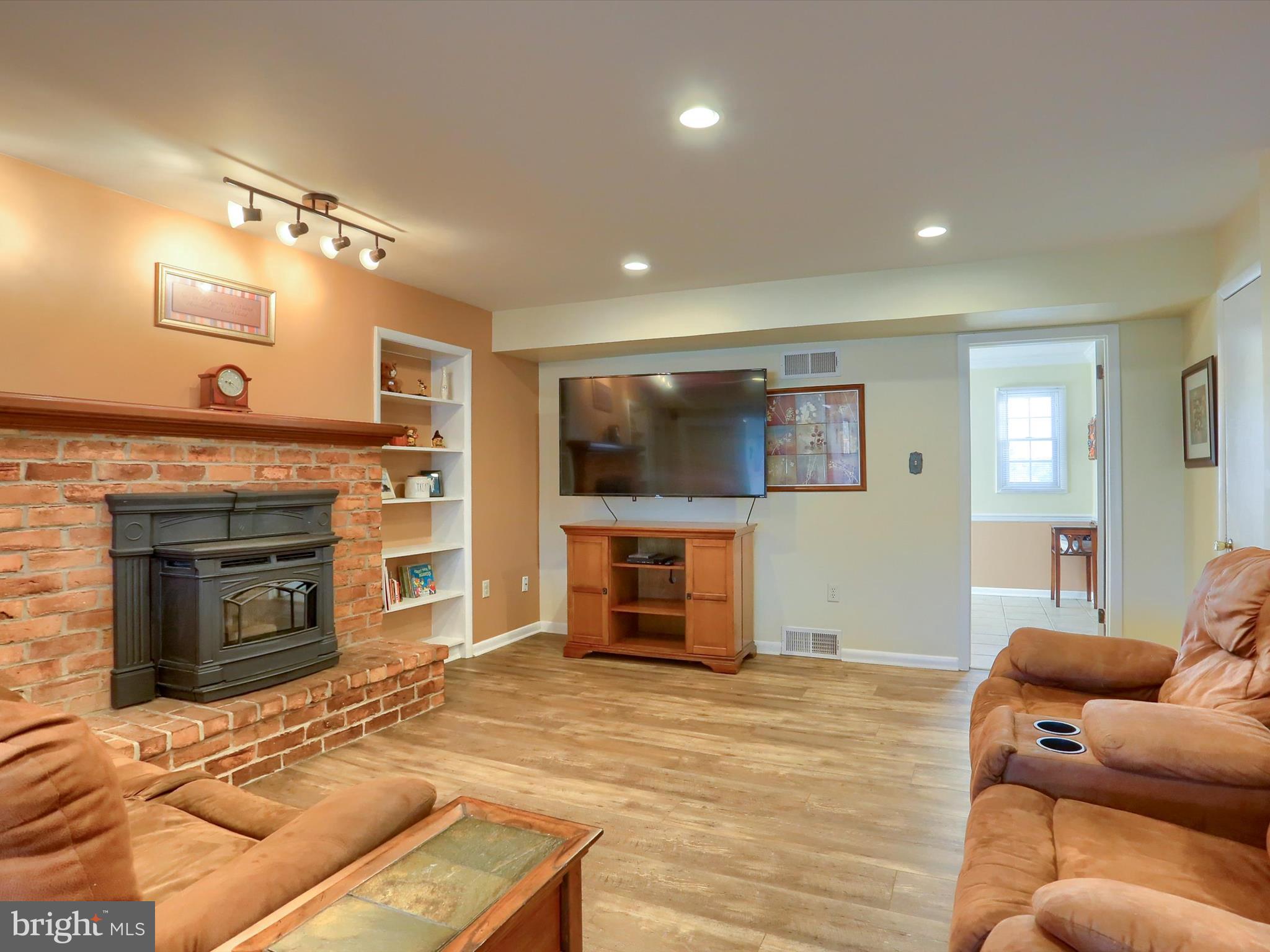 5256 Strathmore Drive Mechanicsburg, PA 17050 - Photo 15 of 47 a living room with furniture and a flat screen tv