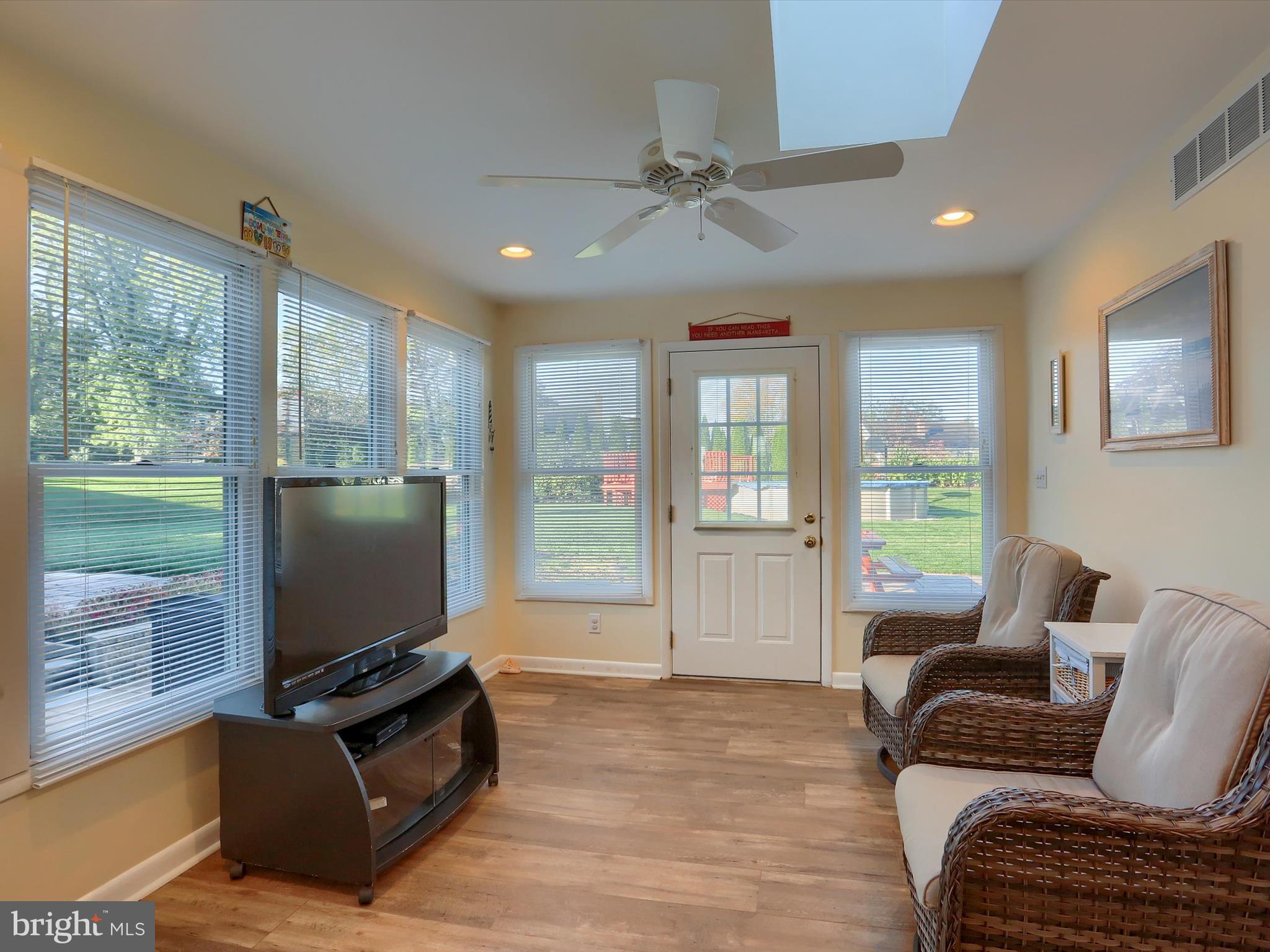 5256 Strathmore Drive Mechanicsburg, PA 17050 - Photo 16 of 47 a living room with furniture and a flat screen tv