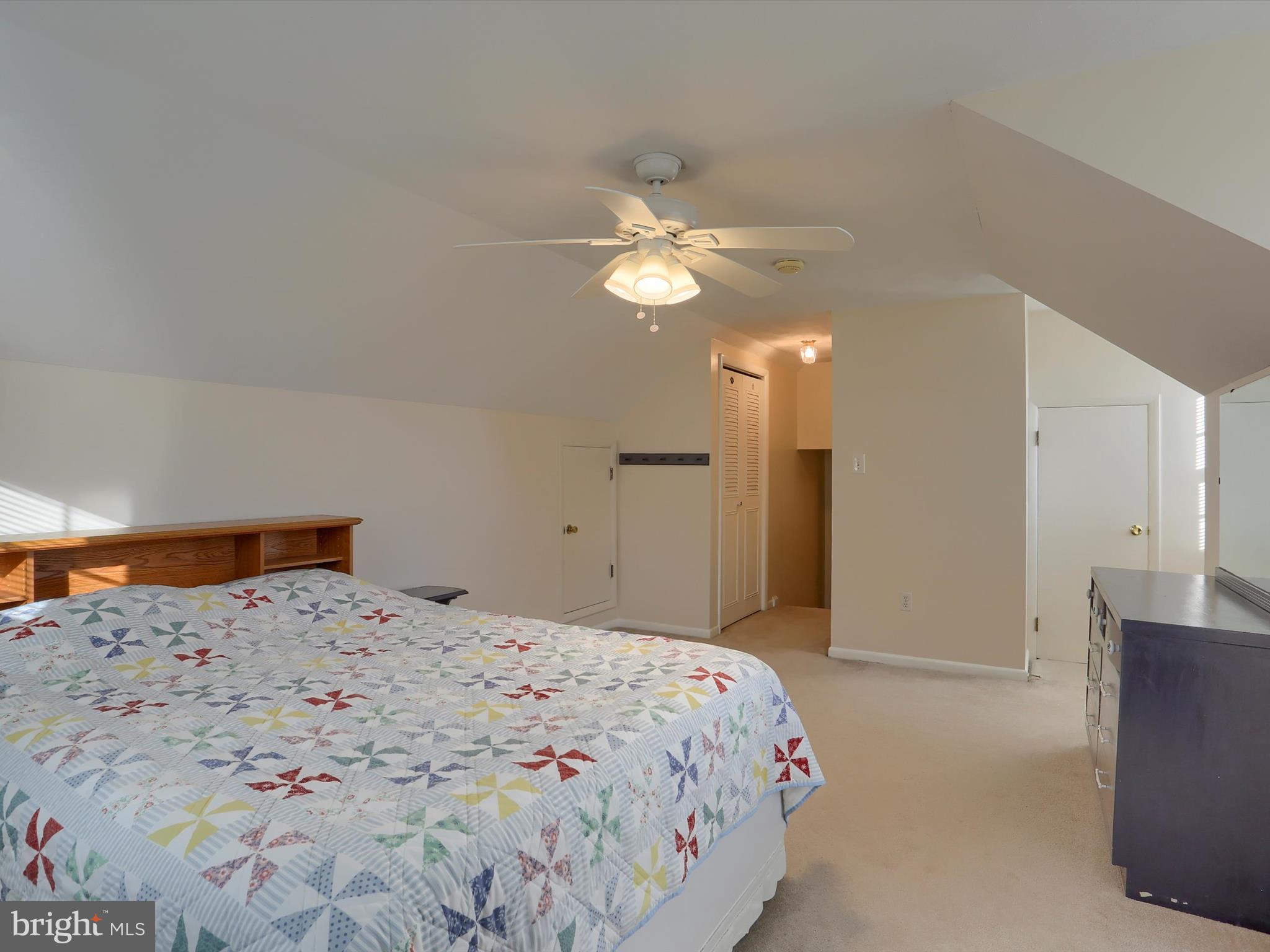 5256 Strathmore Drive Mechanicsburg, PA 17050 - Photo 25 of 47 a bedroom with a bed and a chandelier