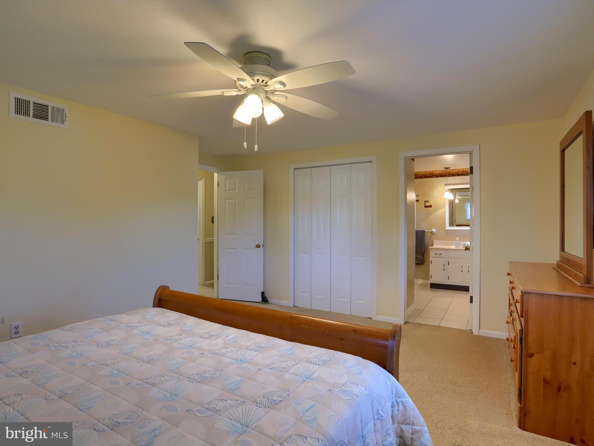 5256 Strathmore Drive Mechanicsburg, PA 17050 - Photo 27 of 47 a bedroom with a bed and a chandelier