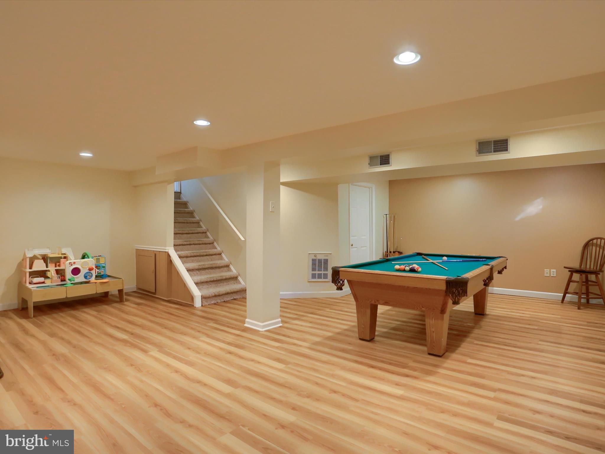 5256 Strathmore Drive Mechanicsburg, PA 17050 - Photo 32 of 47 a view of a room with wooden floor and furniture