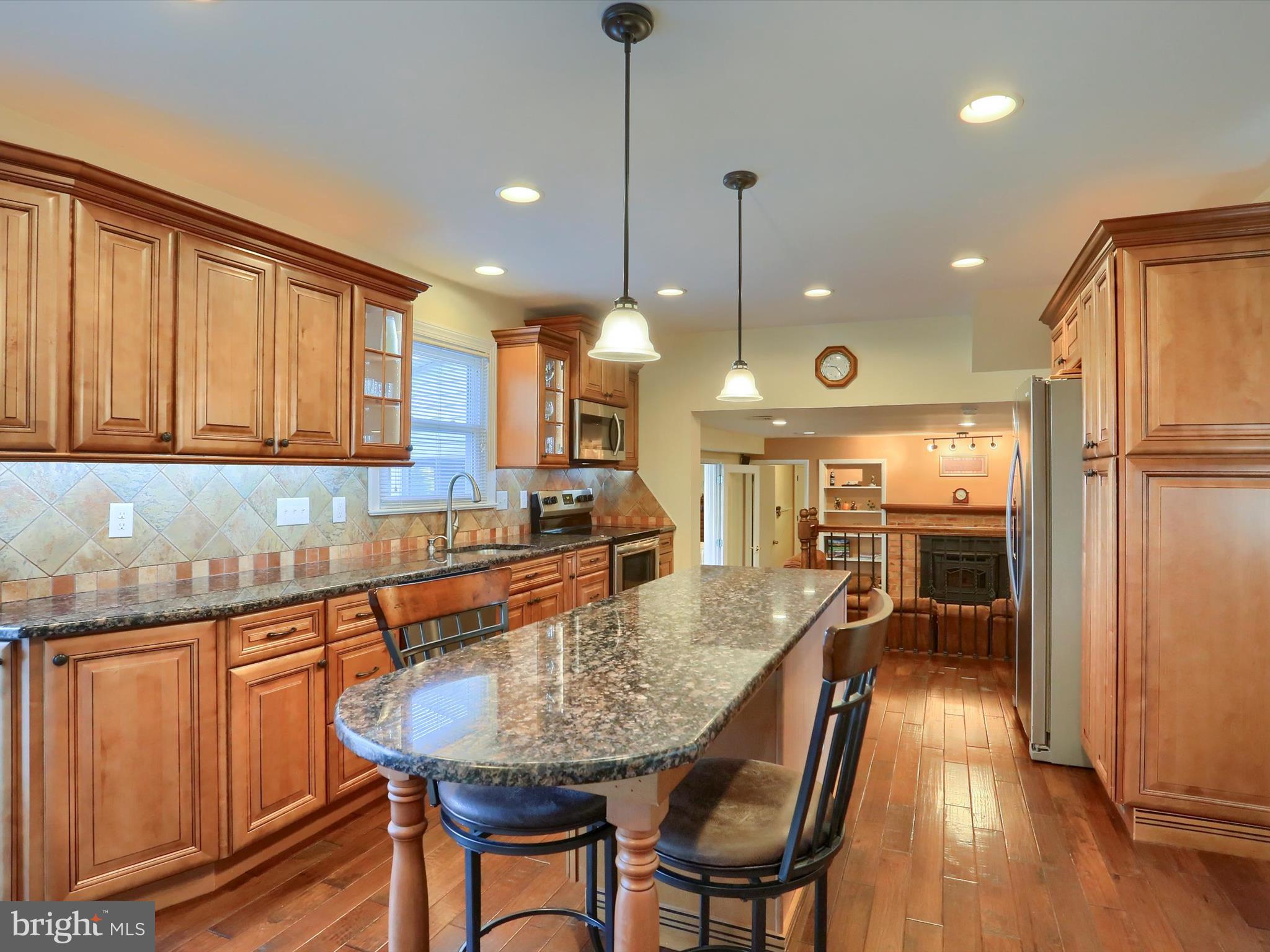 5256 Strathmore Drive Mechanicsburg, PA 17050 - Photo 6 of 47 a kitchen with stainless steel appliances granite countertop counter space a sink refrigerator and cabinets