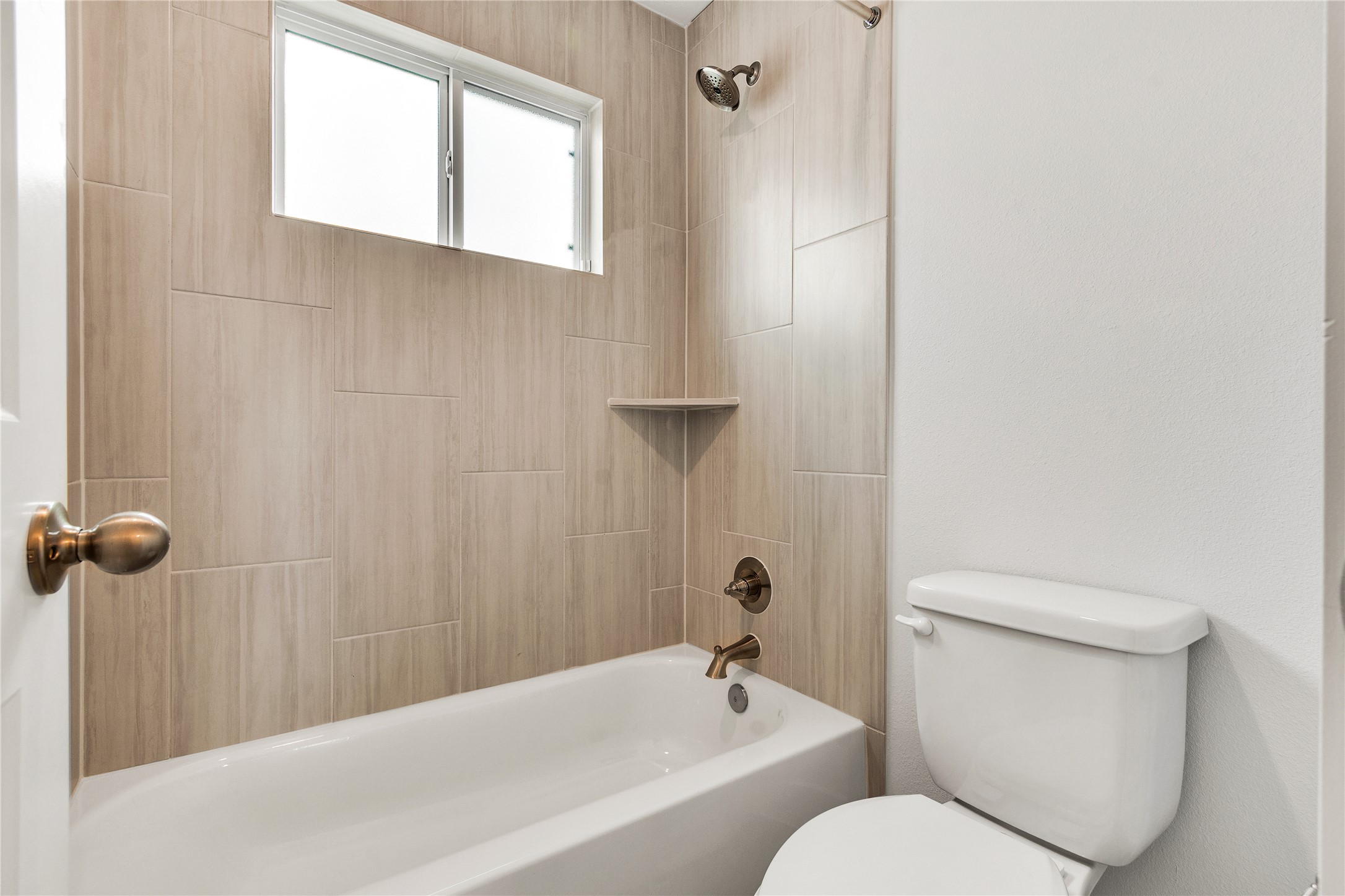 8500 Red Bottle Brush Road Lago Vista, TX 78645 - Photo 24 of 33 A window above the tub allows for natural light in this contemporary bath.