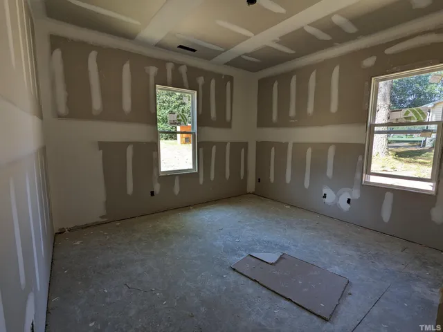 an empty room with windows