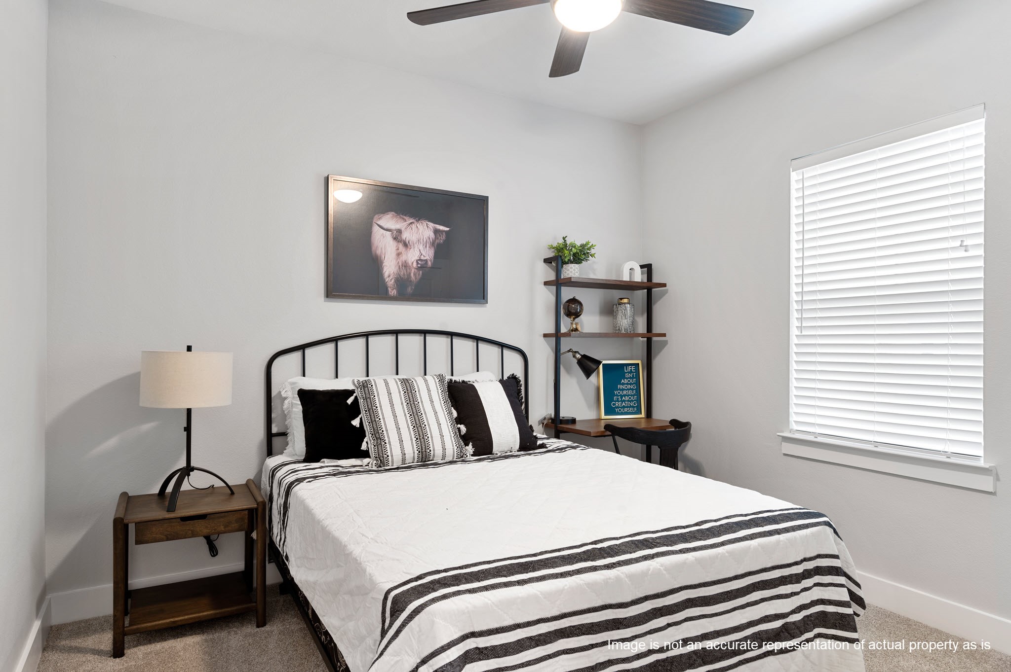 28328-225 Birnham Woods Drive Spring, TX 77386 - Photo 22 of 42 a bedroom with a bed and a chandelier