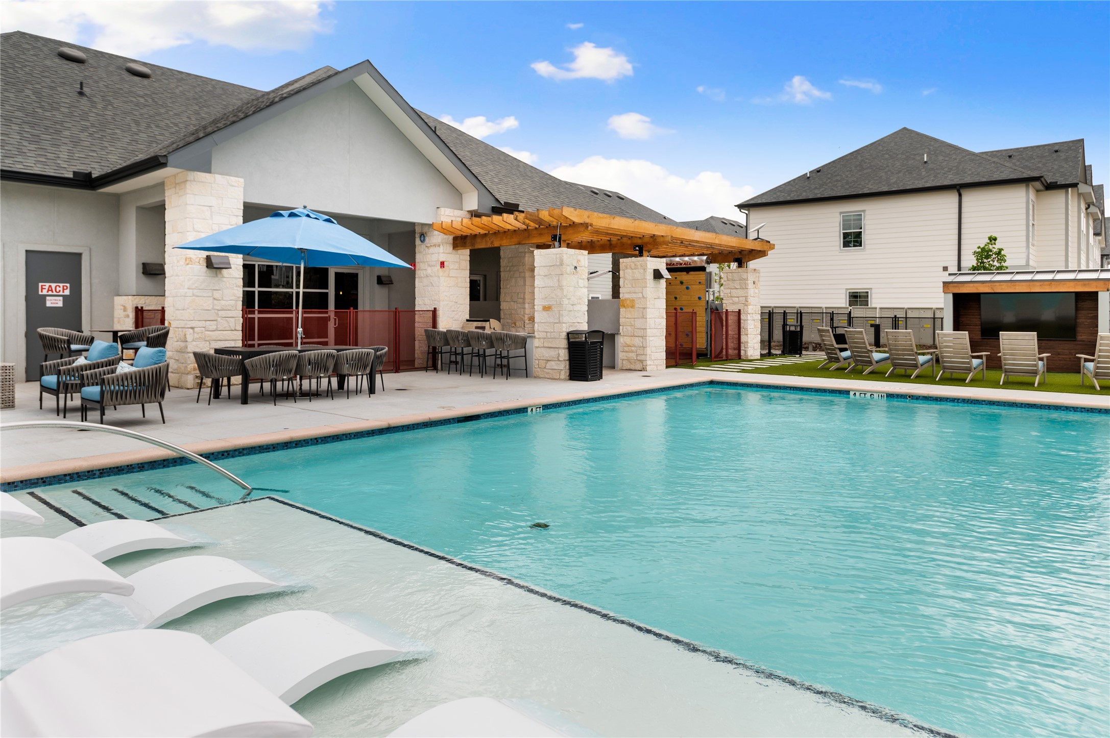 28328-225 Birnham Woods Drive Spring, TX 77386 - Photo 35 of 42 a view of a patio with dining table and chairs under an umbrella