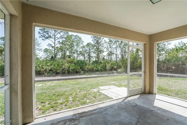 a view of a room with yard from a window