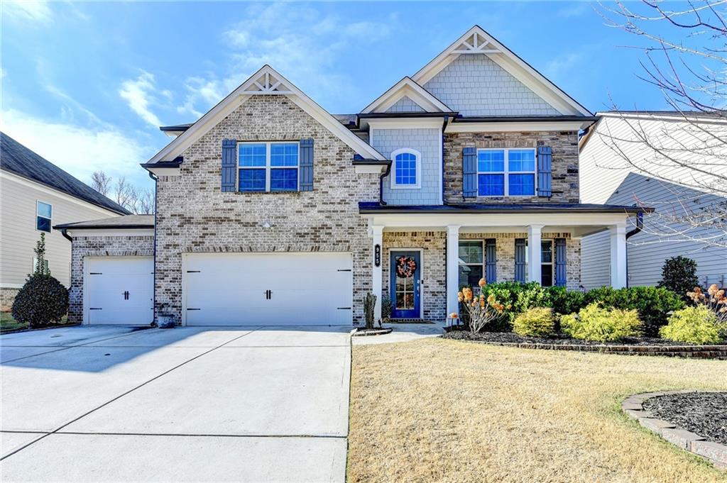 955 Laura Jean Court Buford, GA 30518 - Photo 1 of 68 a front view of a house with yard