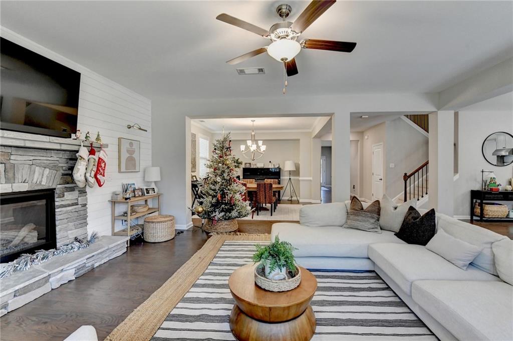 955 Laura Jean Court Buford, GA 30518 - Photo 18 of 68 a living room with furniture fireplace and flat screen tv