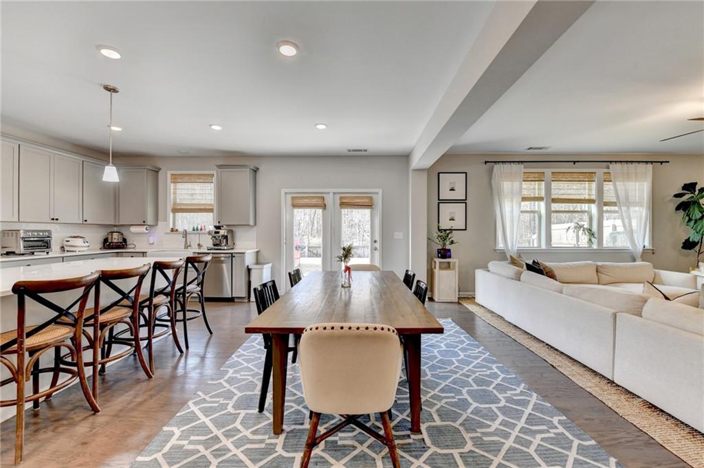 955 Laura Jean Court Buford, GA 30518 - Photo 32 of 68 a large dining space with furniture and a large window