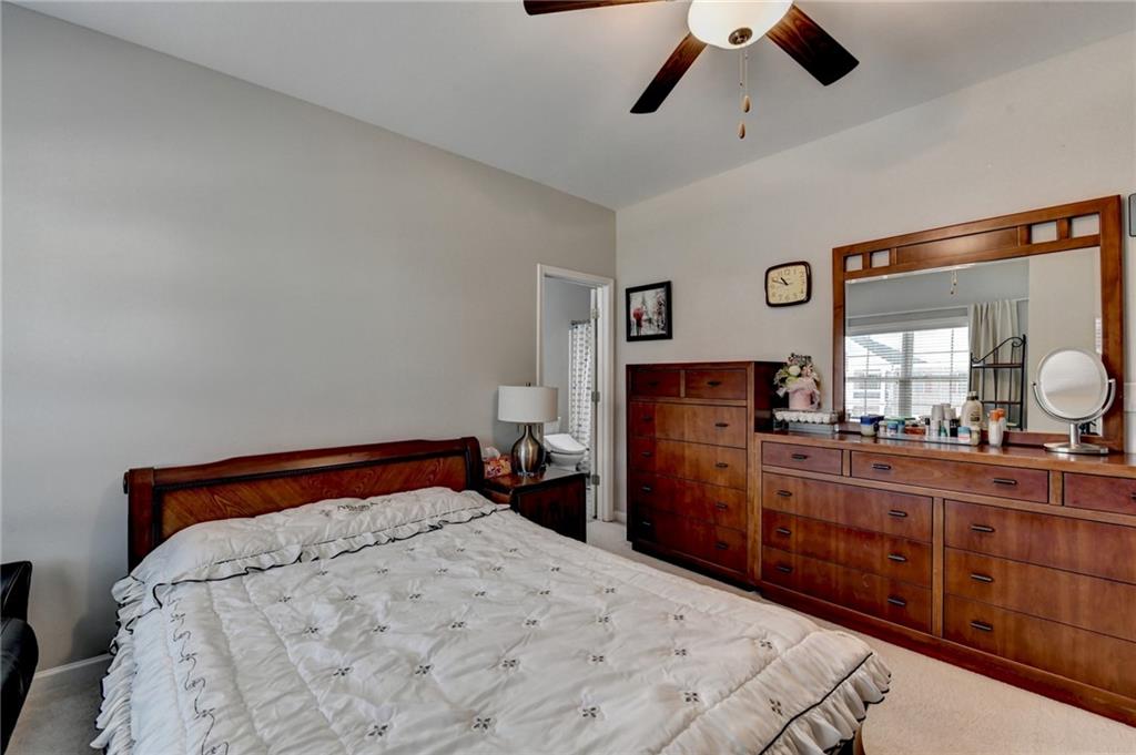 955 Laura Jean Court Buford, GA 30518 - Photo 57 of 68 a bedroom with a bed and wooden floor