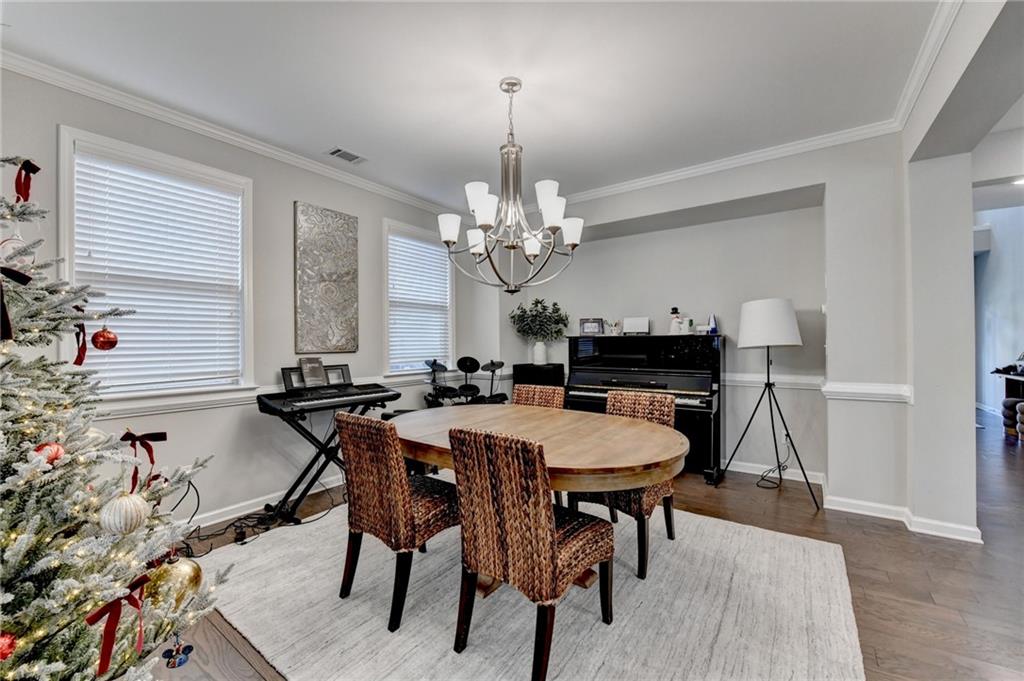 955 Laura Jean Court Buford, GA 30518 - Photo 9 of 68 a view of a dining room with furniture and chandelier