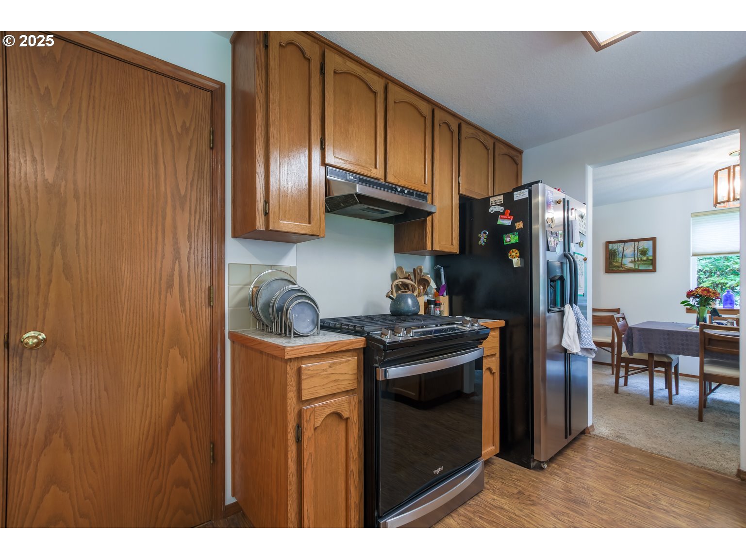1809 Northwest 310th Street Ridgefield, WA 98642 - Photo 13 of 37 a kitchen with stainless steel appliances granite countertop a refrigerator and a stove top oven