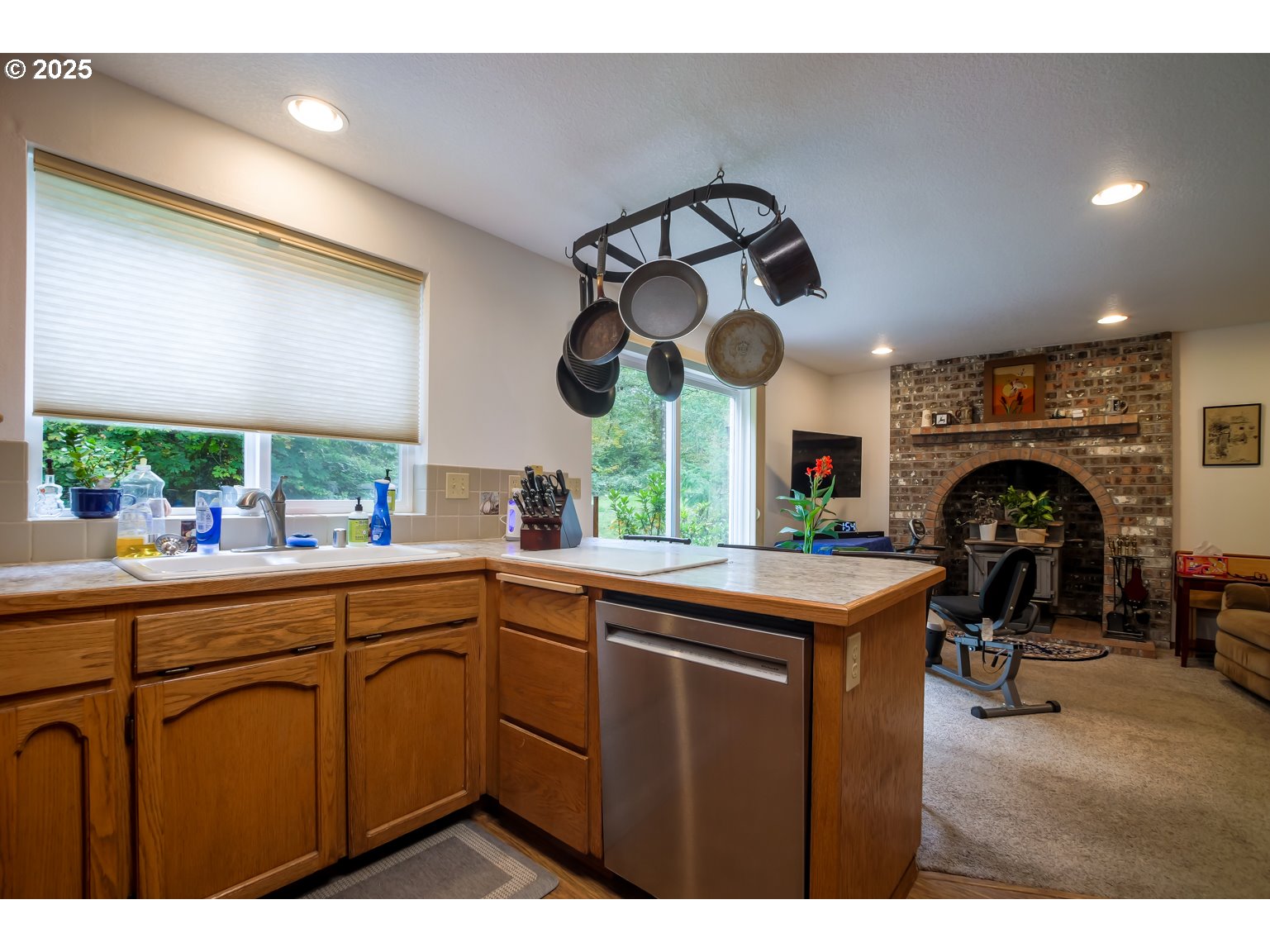 1809 Northwest 310th Street Ridgefield, WA 98642 - Photo 14 of 37 a kitchen with stainless steel appliances granite countertop a sink and cabinets