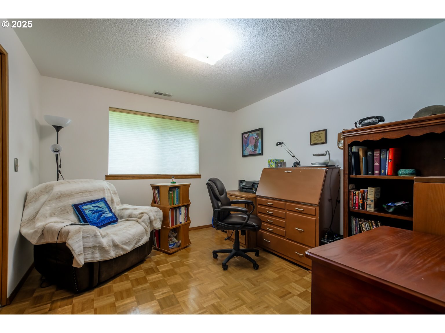 1809 Northwest 310th Street Ridgefield, WA 98642 - Photo 19 of 37 a bedroom with furniture and a book shelf