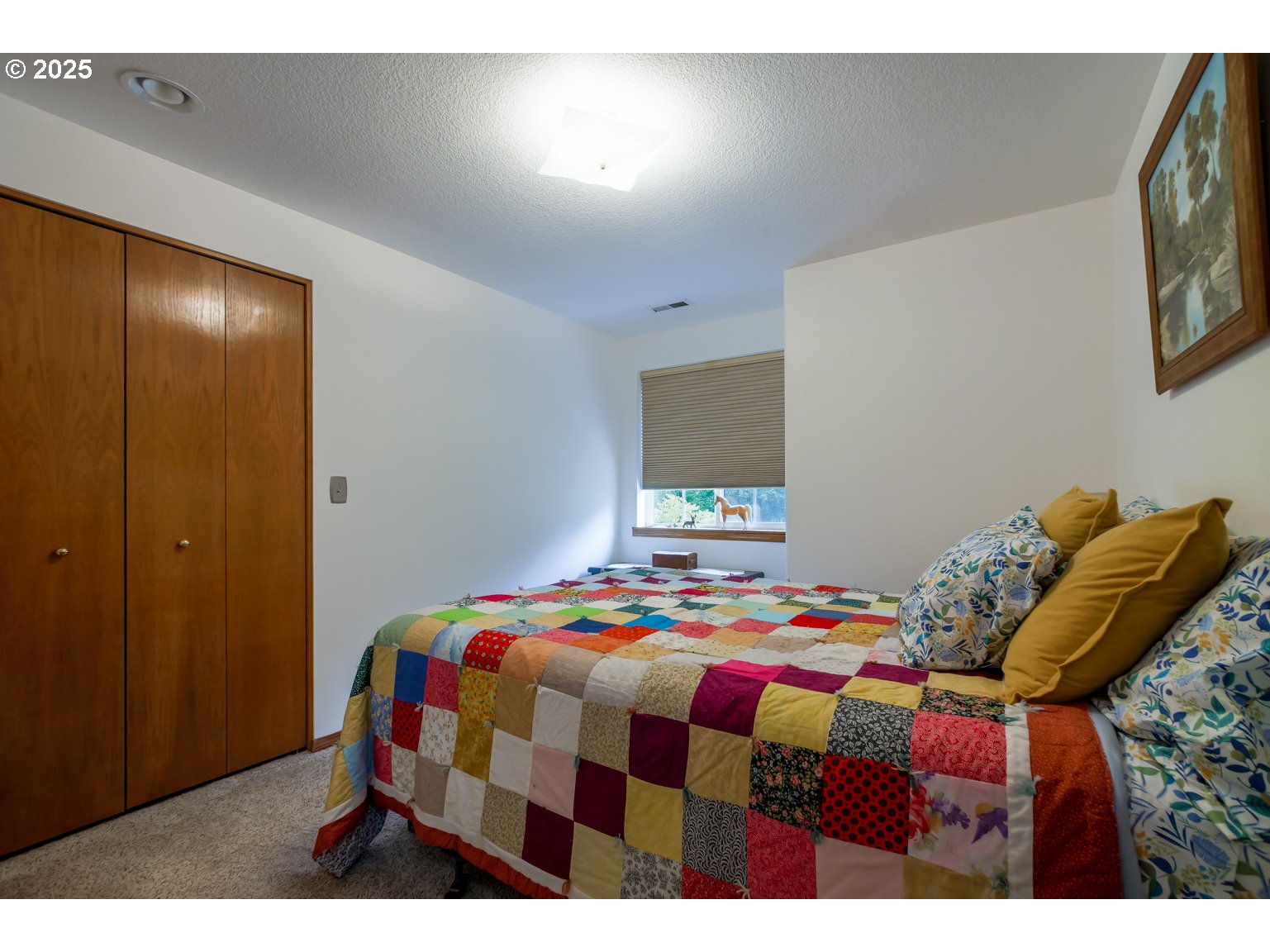 1809 Northwest 310th Street Ridgefield, WA 98642 - Photo 20 of 37 a bedroom with a bed and a lamp on dresser