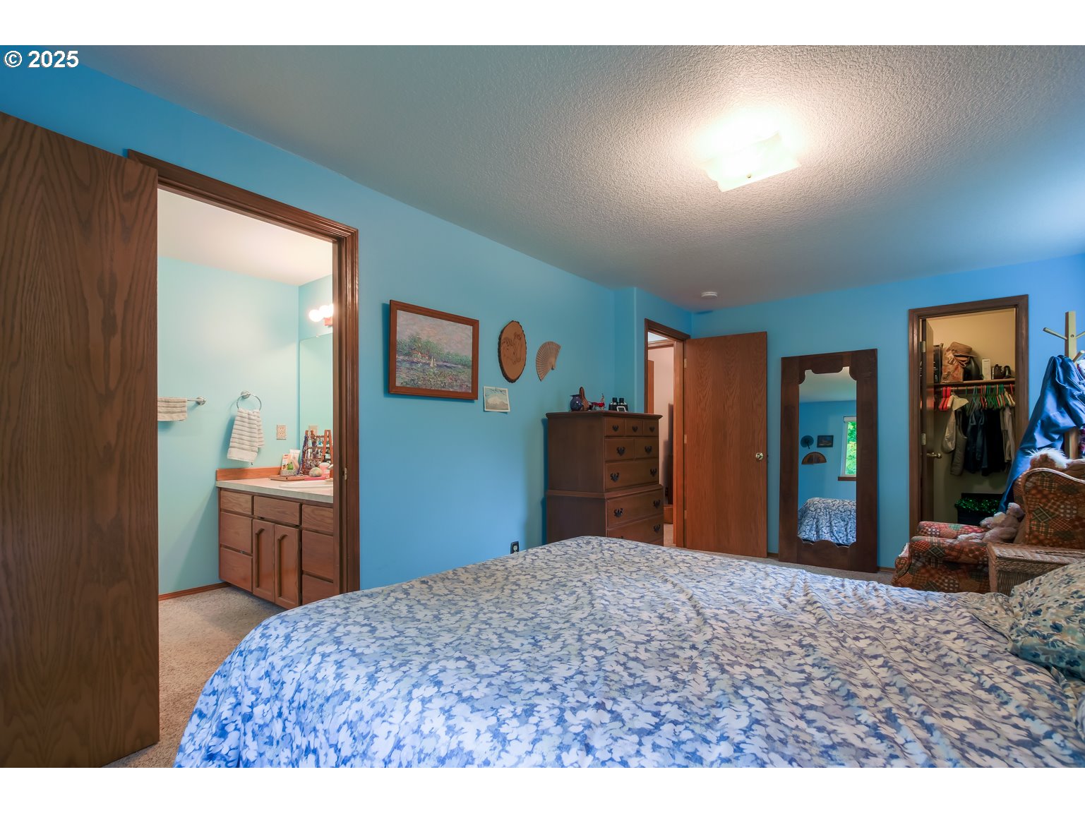 1809 Northwest 310th Street Ridgefield, WA 98642 - Photo 23 of 37 a bedroom with a bed and wooden floor