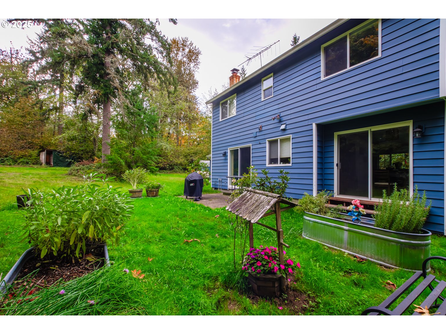1809 Northwest 310th Street Ridgefield, WA 98642 - Photo 31 of 37 a front view of a house with a yard and potted plants