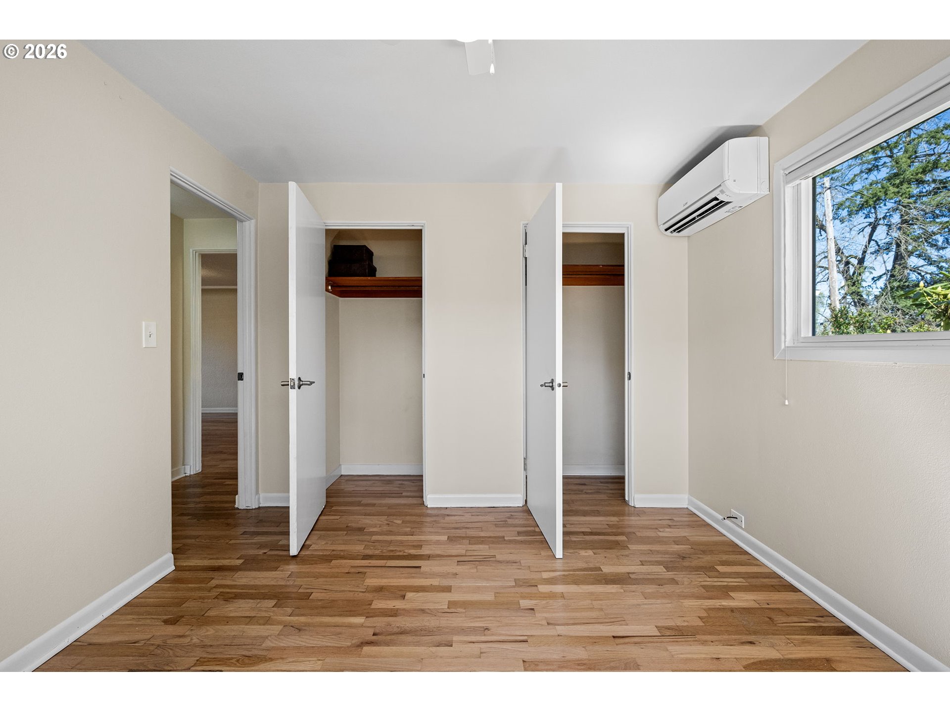 1255 Taylor Street Eugene, OR 97402 - Photo 9 of 48 a view of an empty room with wooden floor and a window