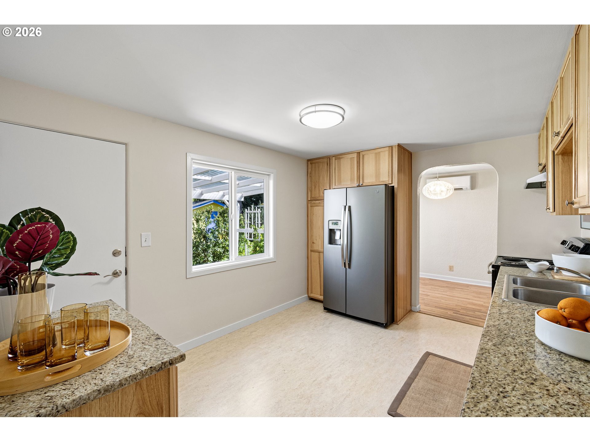 1255 Taylor Street Eugene, OR 97402 - Photo 15 of 48 a kitchen with refrigerator and window