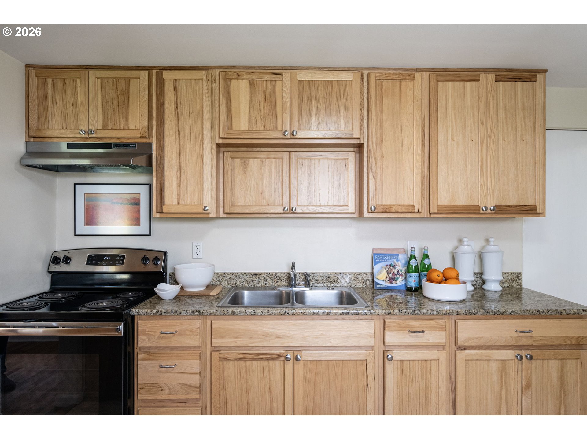 1255 Taylor Street Eugene, OR 97402 - Photo 18 of 48 a kitchen with stainless steel appliances granite countertop a sink stove and microwave with wooden floor